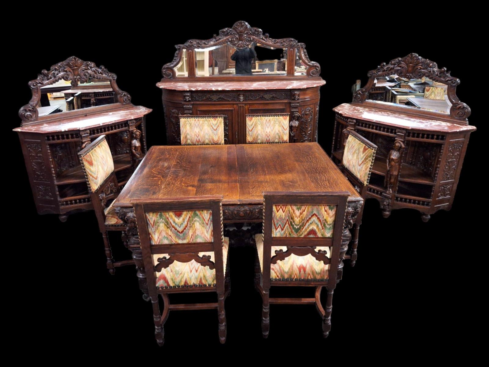 Richly carved Renaissance styled dining suite.